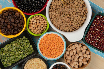 assorted bowls with raw grain and seeds top view