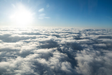Fototapeta na wymiar Fluffy white clouds from above