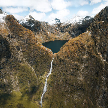 Amazing aerial view of mountain Lake Quill and Sutherland Falls on the scenic flight from Milford Sound to Queenstown, Fiordland, New Zealand