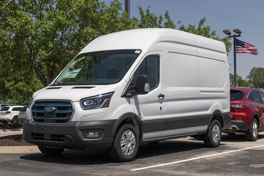 Ford E-Transit Cargo Van Display At A Dealership. Ford Offers The E-Transit In Cargo Van, Chassis Cab Or Cutaway Models.