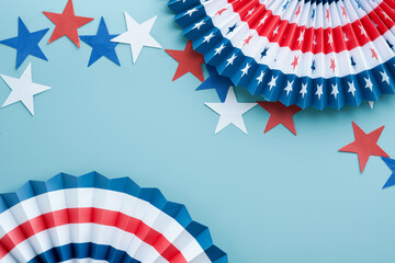 Fototapeta 4th of July background. USA paper fans, Red, blue, white stars and confetti on blue wall background. Happy Labor Day, Independence Day, Presidents Day. American flag colors. Mock up. Top view. obraz