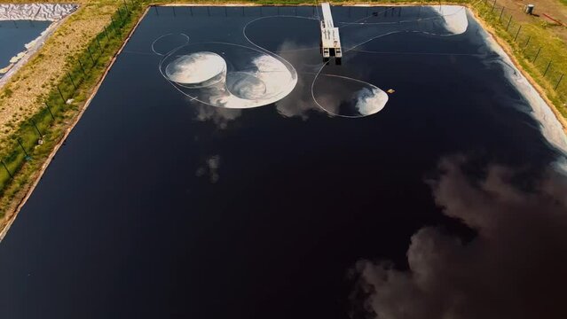 Water treatment equipment. Dirty water filtration outside. Biological purification in a pond. Dirty water infiltration into the pond