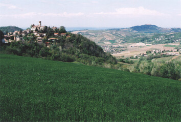 Beautiful View of Fortunago Medieval Village on the Hill during Spring. Pavia Province, Italy. Film Photography