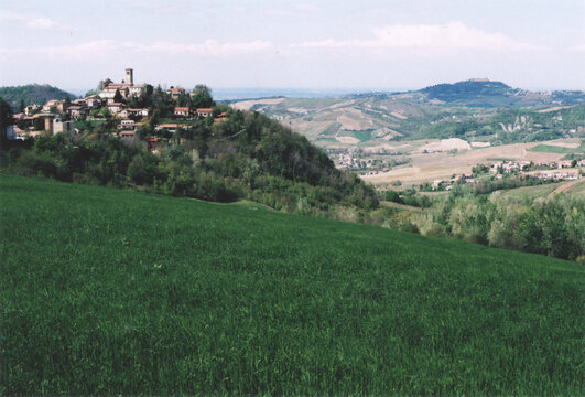 Beautiful View of Fortunago Medieval Village on the Hill during Spring. Pavia Province, Italy. Film Photography