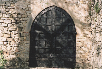 Ancient Iron Door of a Traditional Italian Medieval House. Zavattarello, Pavia Province, Italy. Film Photography