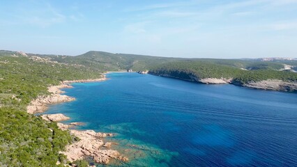 Enchanting Aerial Voyage: The Diverse Landscapes of Paraguano Bay, Bonifacio, Corsica – From Rugged Rocky Shores to Serene Blue Bay and Verdant Forests