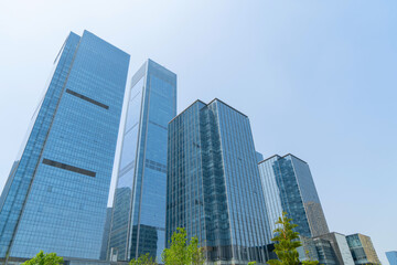 Naklejka premium Looking Up Blue Modern Office Building