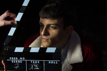 Actor ready for the ciak cinema scene during the production of short film in the night. Man inside...