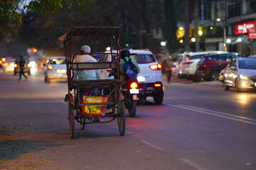 An old man driving a rikshaw , sonipat, Haryana, India 20 may 2023 - obrazy, fototapety, plakaty