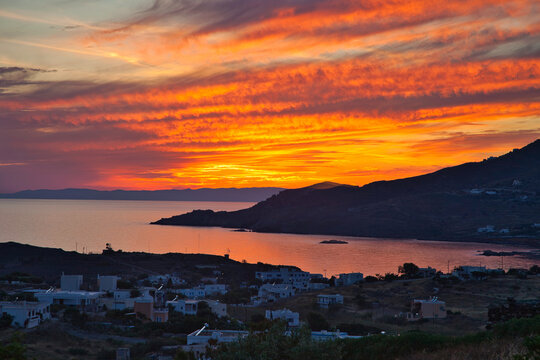 Sunset Over The Sea. Dramatic red cloudscape over Finikas Bay in Syros Island, Greece. Stock Image.