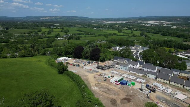 Newton Abbot, South Devon, England: DRONE AERIAL VIEWS: A construction site for new build houses on green belt land in the TQ12 postcode area (Clip 1)