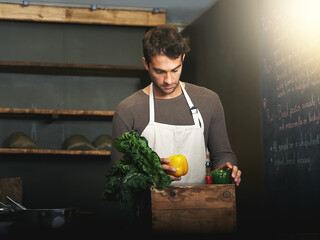 Man, market and owner with vegetables or groceries in a bag for cooking or chef in the kitchen and...