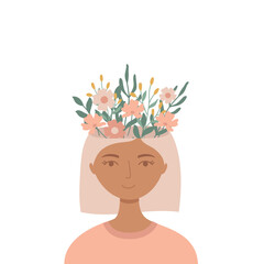 Young woman with flowers in her head. Positive thinking and mental health concept