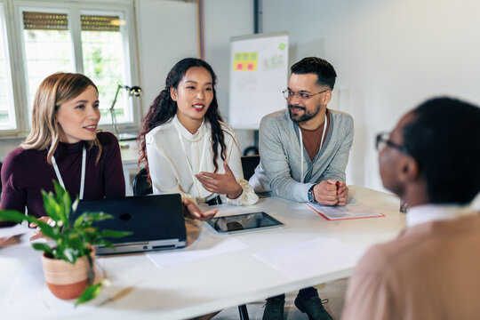 Human resources managers conducting job interviews with applicants in the office