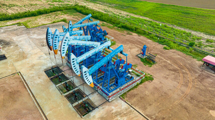 Top view In the field crude oil country industry the oil rig pump in the evening of the pumping unit