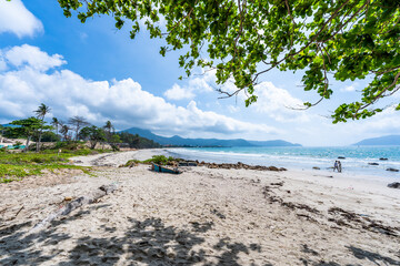 a peaceful Con Dao island, Vietnam is a Vietnamese island heaven. Coastal view with waves, coastline, clear sky and road, blue sea, tourists and mountain