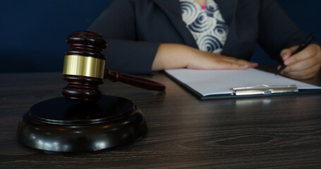 Legal counsel presents to the client a signed contract with gavel and legal law. Justice and lawyer law of advisor Concepts