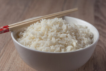 cooked rice on bowl on wooden background, Jasmine rice cooked
