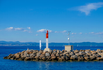 Meteorological station. Breakwater. Yachts in the distance. Porquerolles Island. Mediterranean Sea....