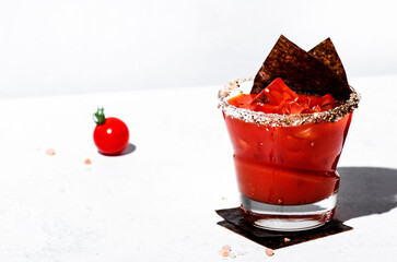 Miso bloody mary alcoholic cocktail drink with tomato juice, japan spices, vodka and nori. White background, hard light, steel bar tools © 5ph