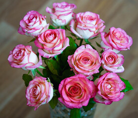 Bouquet of rose flowers on blurred background, horizontal orientation