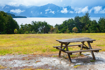 Picnic table overloking Manapouri Lake in Southland South Island New Zealand
