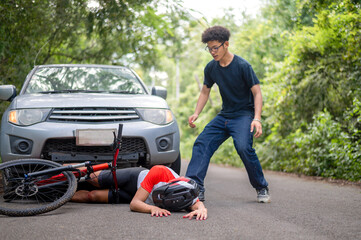 Car accident with MTB mountain bike rider and first aid : Young Asian man driving a car crashes...