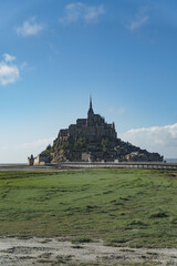 Obraz premium St Mont Michel. Mont-Saint-Michel in France. A grand, awe inspiring building of historic significance, the Abbey on the tidal island in Northern France