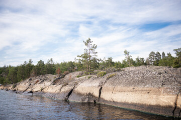 Stone granite island surrounded by water.
