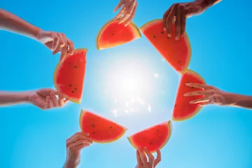 Stickers pour porte Destinations Group of friends eat fresh watermelon together