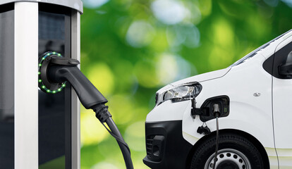 Electric delivery van with electric vehicles charging station.. © scharfsinn86