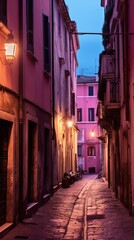 Fototapeta premium Empty historic center of a small ancient Italian town illuminated by lanterns during sunset - Generative AI