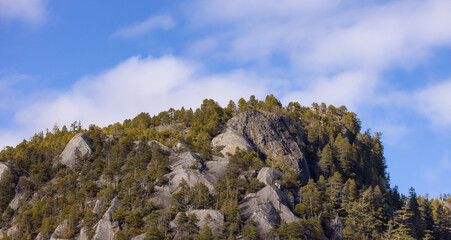 Rocky cliffs on Chief Mountain in Squamish, BC, Canada. Nature Background. Sunny day.