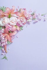 Obraz na płótnie Canvas beautiful summer flowers on color paper background