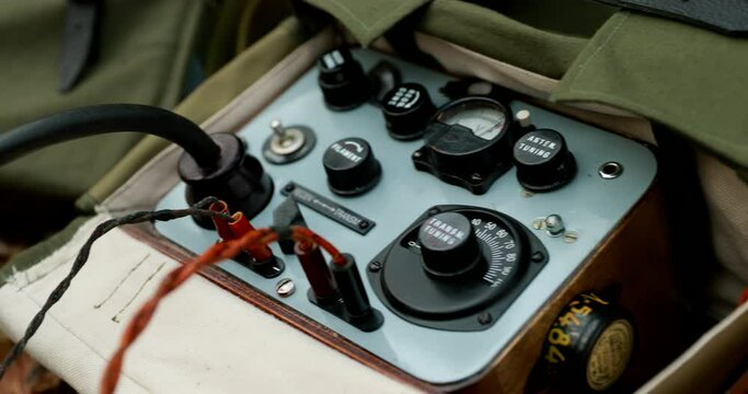 Russian Soviet Infantry Red Army Soldier In World War II using Russian Soviet Portable Radio Transceiver In Trench Entrenchment In Spring Autumn Forest. 4K. Headphones And Telegraph Key. Close Up
