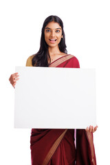 Naklejka premium Exited Indian woman in traditional saree holding sign board isolated on white. advertisement concept. 