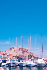 Fototapeta na wymiar The marina of Calvi in Corsica, with the famous citadel in the background