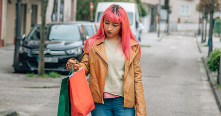 urban woman shopping with bags on the street