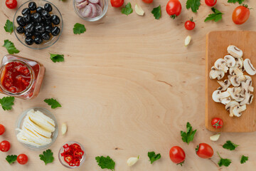 Ingredients for making pizza, food background with copy space, top view