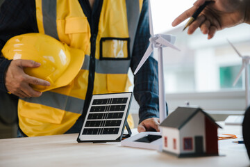 engineer and contractor planning to install solar panel on building rooftop