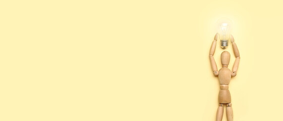 Wooden human figure with light bulb on beige background with space for text. Insight concept