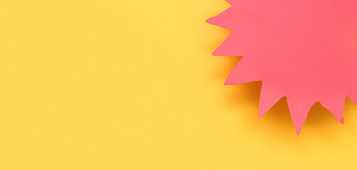 Sun made of paper on yellow background with space for text