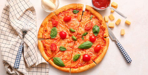 Tasty cut pizza margarita on light table, top view