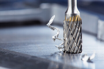 Milling cutter make sink in hole in steel billet. Locksmith work.