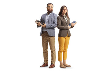 Full length shot of a man and woman posing and holding books