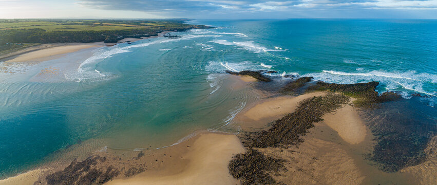 Aerial view in panorama format of a coastline with river mouth in the vicinity of the village of Vila Nova de Milfontes