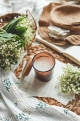 Aroma candle in a cozy home spring interior