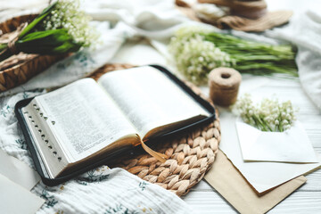 Open bible in spring interior, good morning concept