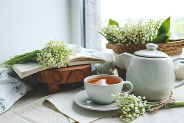 Cup of hot tea and spring home interior. good morning concept