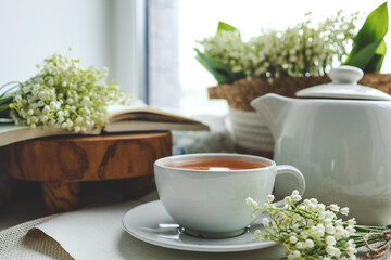 Cup of hot tea and spring home interior. good morning concept